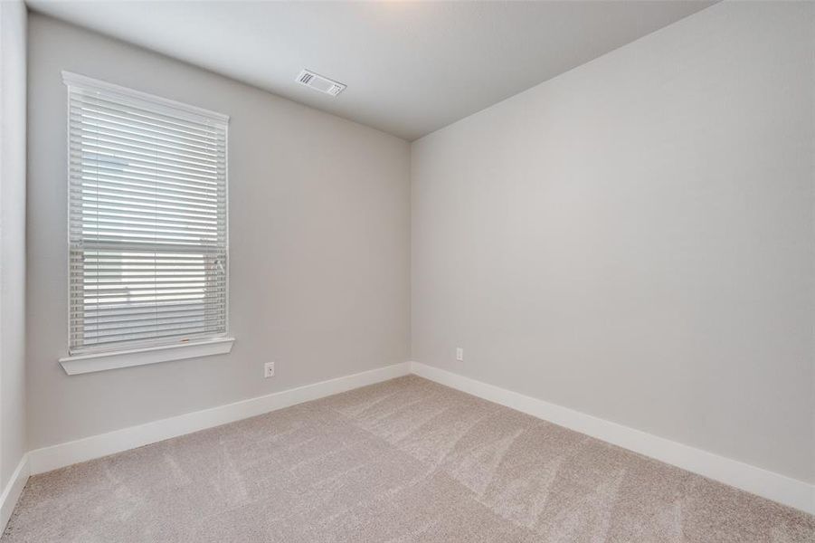 Unfurnished room featuring carpet floors and baseboards