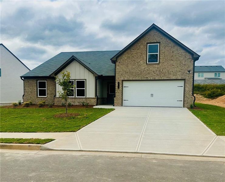 Front exterior of a new home in , Auburn, GA, highlighting curb appeal (Image 1).