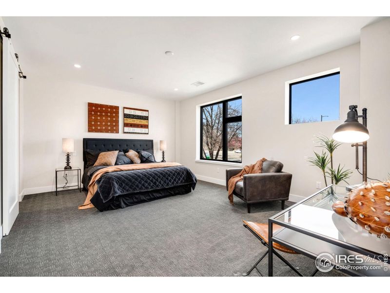 Large primary bedroom with great natural light