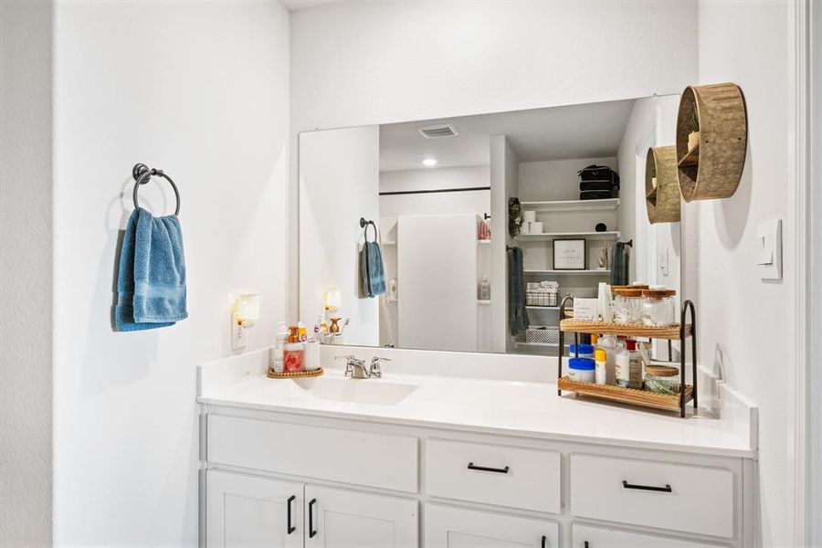 Full bath featuring vanity and a shower with shower curtain