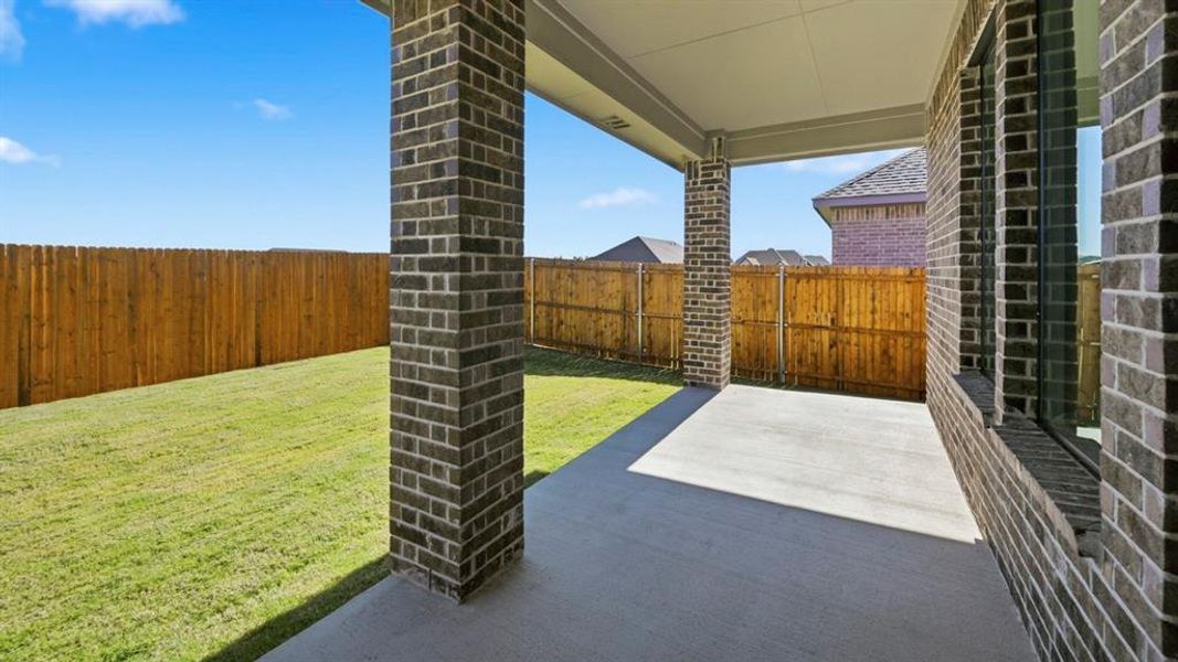Fenced backyard featuring a patio area