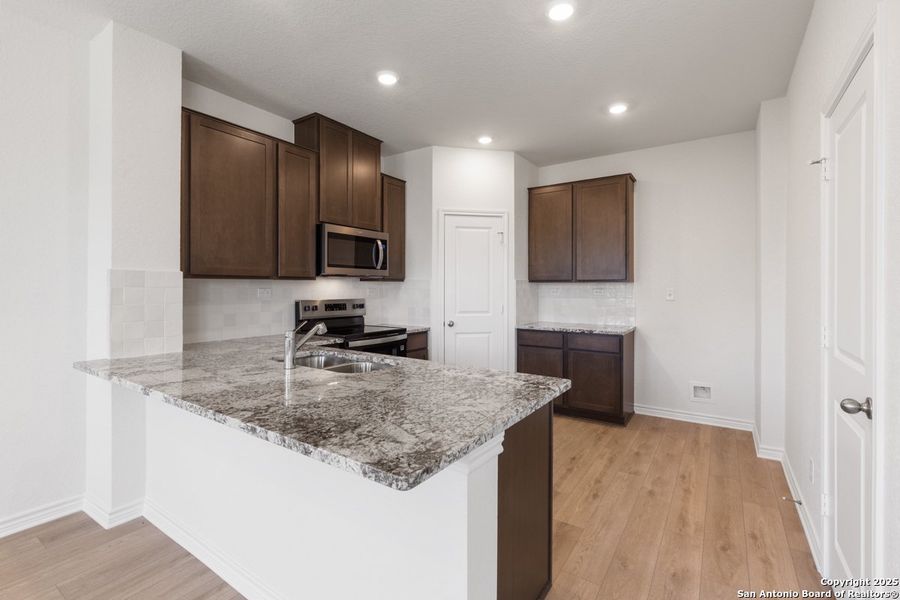 Furnished interior view inside a new home in Knox Ridge, Converse (Image 6). Furnished interior view inside a new home in Knox Ridge, Converse (Image 6).