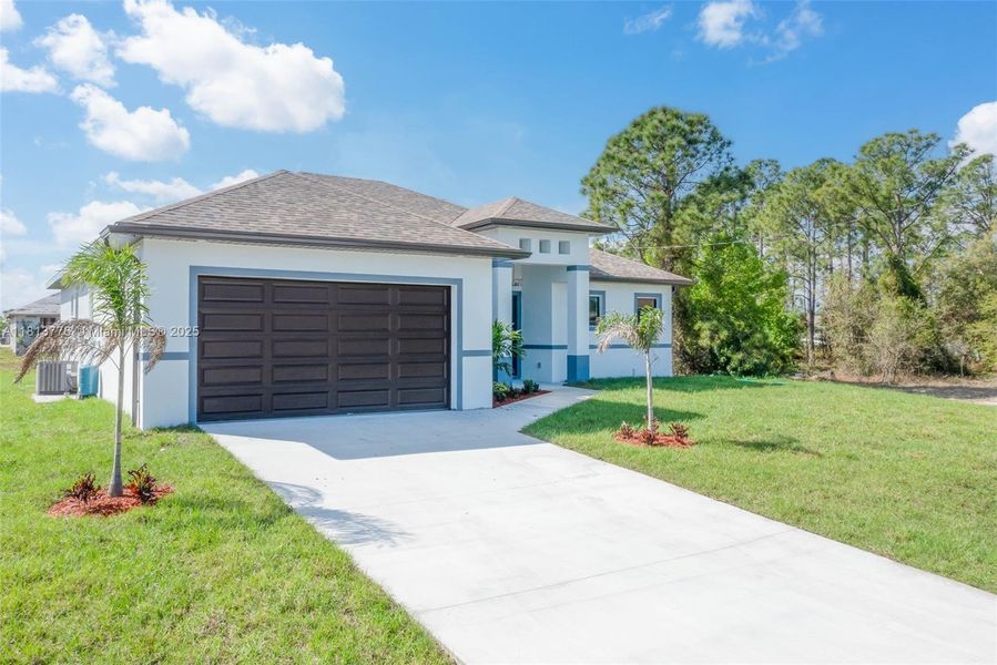 Front exterior of a new home in , Lehigh Acres, FL, highlighting curb appeal (Image 2).