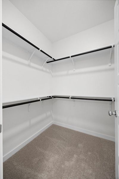 Primary Closet in the Cypress home plan by Trophy Signature Homes - REPRESENTATIVE PHOTO