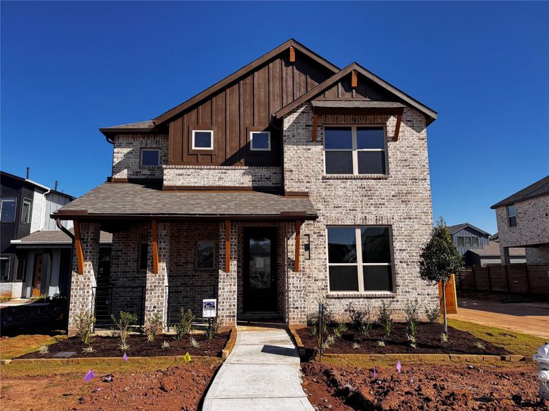 Front exterior of a new home in Indigo: 40ft. lots, Richmond, TX, highlighting curb appeal (Image 2).