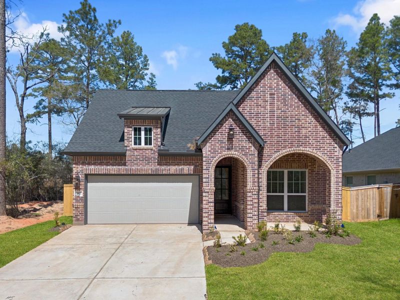 Front exterior of a new home in Attwater, Waller, TX, highlighting curb appeal (Image 2).