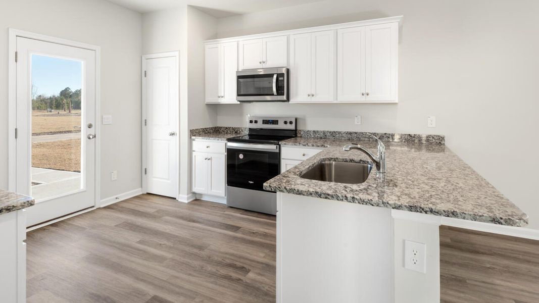 Representative furnished interior of a home built from the DELANEY by D.R. Horton in The Cottages at Blake Farm, Wilmington (Image 13). Representative furnished interior of a home built from the DELANEY by D.R. Horton in The Cottages at Blake Farm, Wilmington (Image 13).