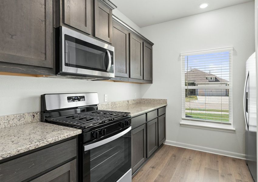 The kitchen of the Driftwood has beautiful wood cabinetry. The kitchen of the Driftwood has beautiful wood cabinetry.
