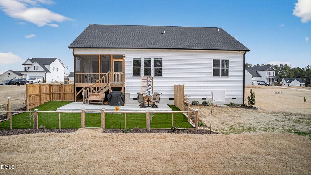 Fenced in area with artificial turf