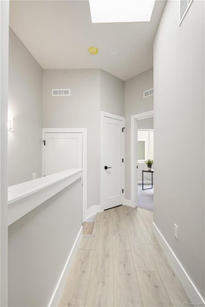 2nd Floor Laundry At Top of Stairs. Hall Skylight Adds Lots of Natural Light