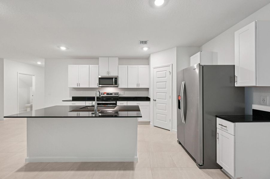 Furnished interior view inside a new home in Meritage Homes at Terra Lago - Premier Series, Indiantown (Image 9).