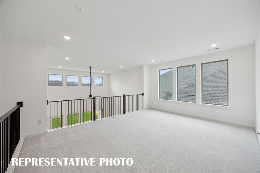 Plenty of family fun time to be had in this spacious, light filled game room!  REPRESENTATIVE PHOTO