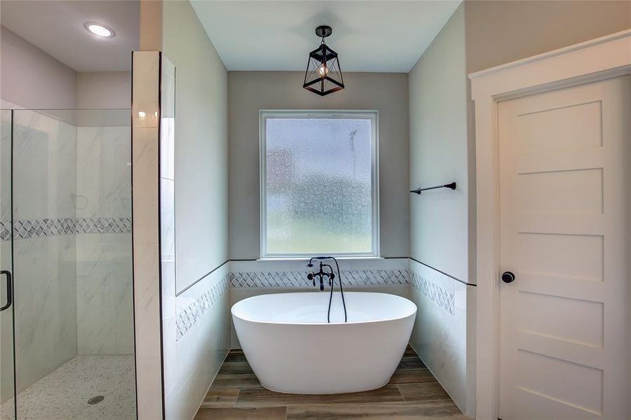 Bathroom featuring independent shower and bath