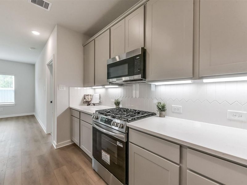 Furnished interior view inside a new home in Sundance Cove, Crosby (Image 11).