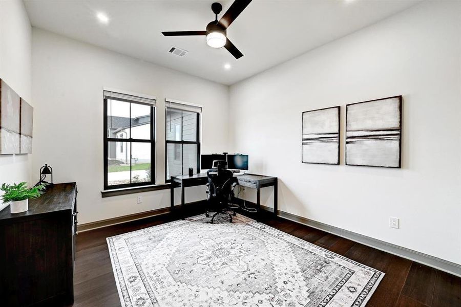 Office space featuring a ceiling fan, dark wood finished floors, and recessed lighting