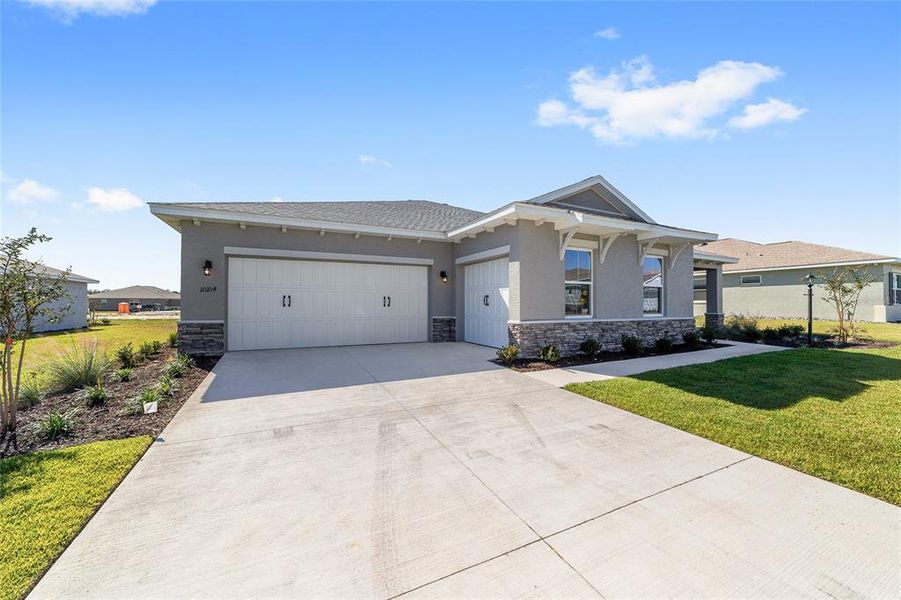 Front exterior of a new home in On Top of the World Communities, Ocala, FL, highlighting curb appeal (Image 22).