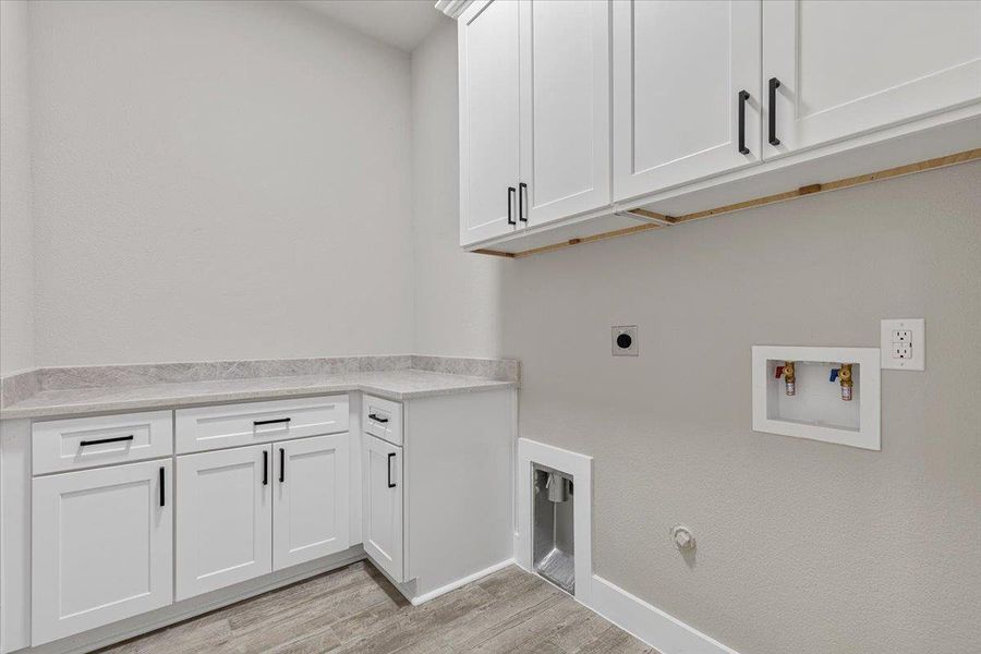 Ample storage and a convenient setup with the laundry room located in the hallway