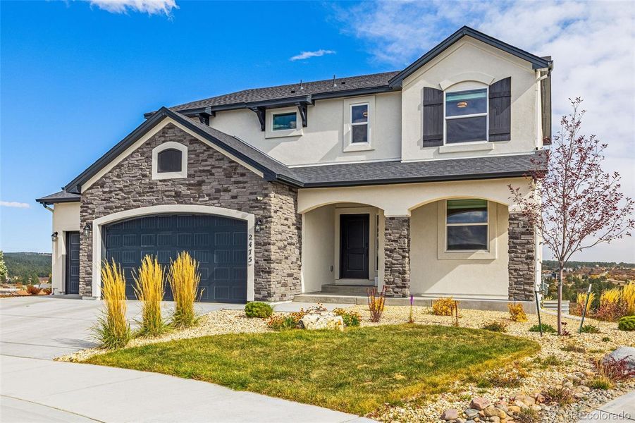 Front exterior of a new home in , Colorado Springs, CO, highlighting curb appeal (Image 20). Front exterior of a new home in , Colorado Springs, CO, highlighting curb appeal (Image 20).
