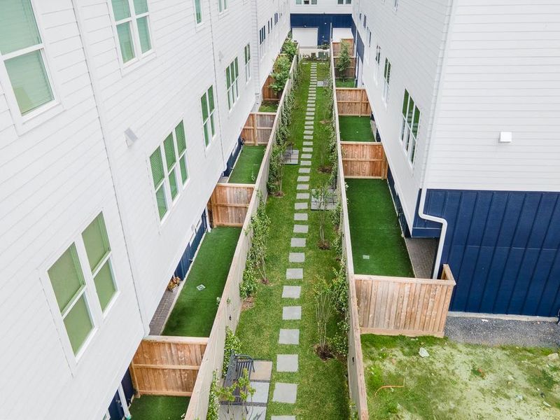 Courtyard area behind your private fenced in back yard.  Walk the dog or sit on a bench and relax.