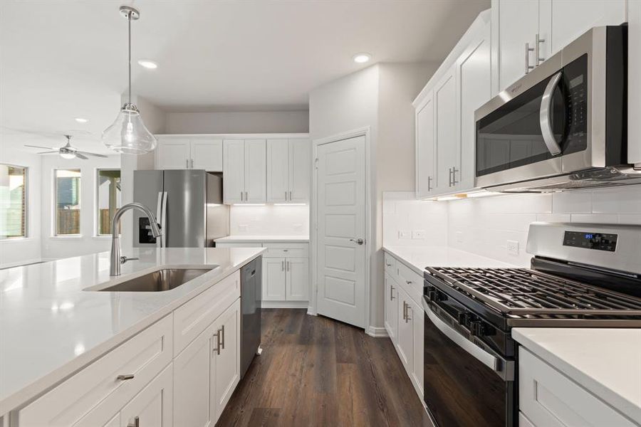 Featuring outstanding storage and prep space plus a spacious kitchen island, any chef would be proud to call this kitchen their own!