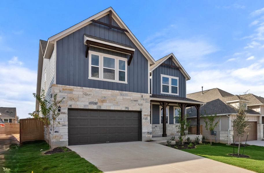 Representative exterior photo of a completed home built from the Somerville by Ashton Woods in Willow Springs, Buda, TX (Image 21).