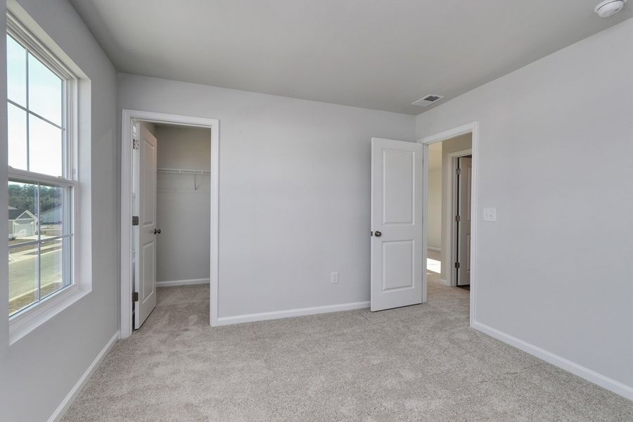 Spacious, unfurnished interior of a new home in Hainer Place, Conway (Image 37).