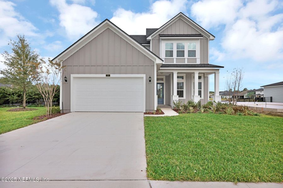 Front exterior of a new home in Reflections at Nocatee, Ponte Vedra, FL, highlighting curb appeal (Image 21).