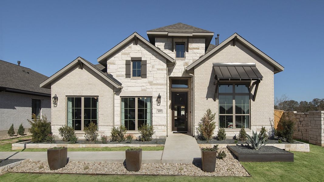 Front exterior of a new home in 6 Creeks 50', Kyle, TX, highlighting curb appeal (Image 2). Front exterior of a new home in 6 Creeks 50', Kyle, TX, highlighting curb appeal (Image 2).