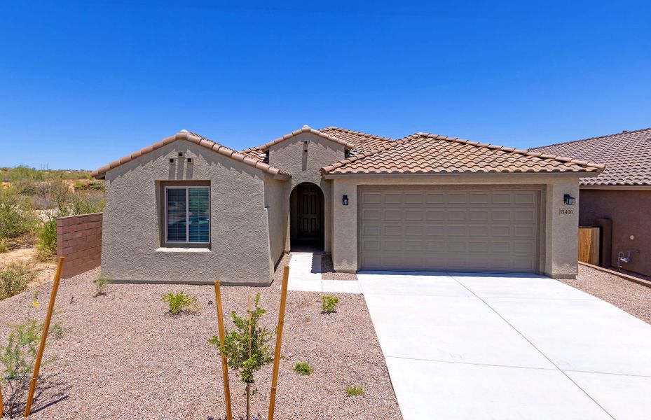 Front exterior of a new home in Vistoso Canyon Estates, Oro Valley, AZ, highlighting curb appeal (Image 2). Front exterior of a new home in Vistoso Canyon Estates, Oro Valley, AZ, highlighting curb appeal (Image 2).