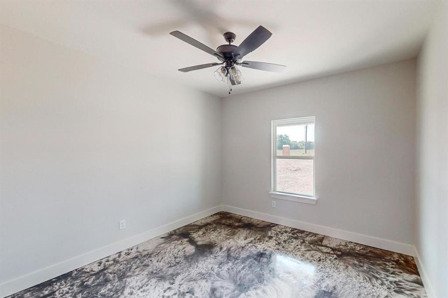 Unfurnished room featuring ceiling fan