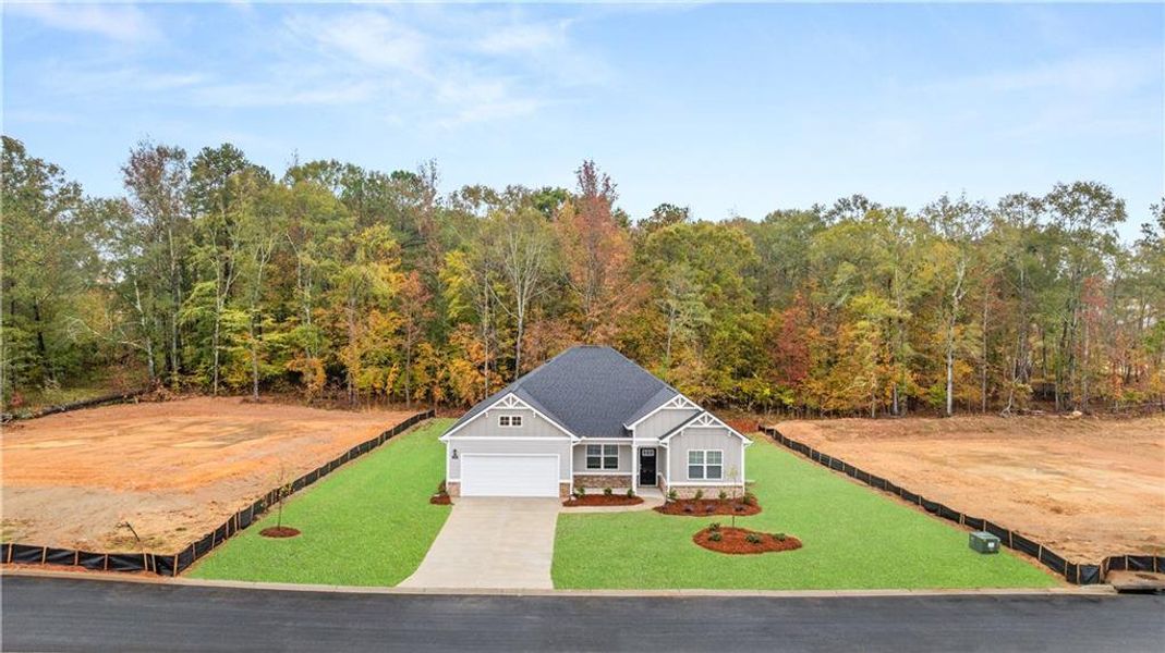 Front exterior of a new home in Kingston Ranch at Lake Oconee, Buckhead, GA, highlighting curb appeal (Image 18). Front exterior of a new home in Kingston Ranch at Lake Oconee, Buckhead, GA, highlighting curb appeal (Image 18).