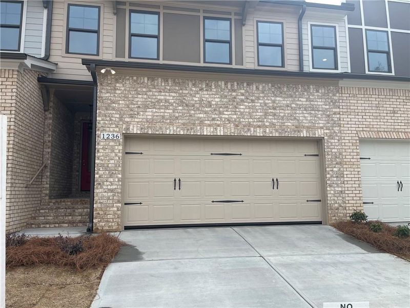 Exterior details and patio area of a home in The Collection at Wolf Creek, Lawrenceville (Image 3).
