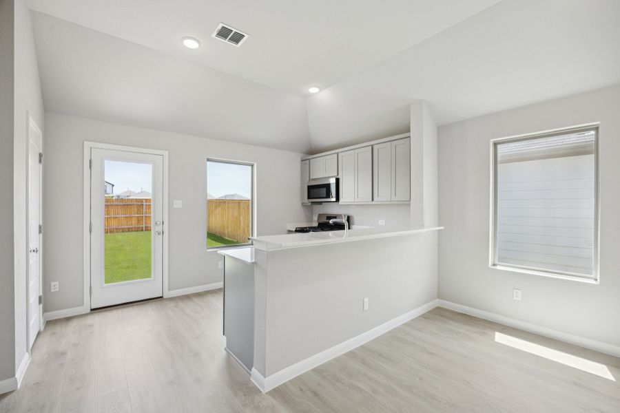 Kitchen in the Pine home plan by Trophy Signature Homes - REPRESENTATIVE PHOTO