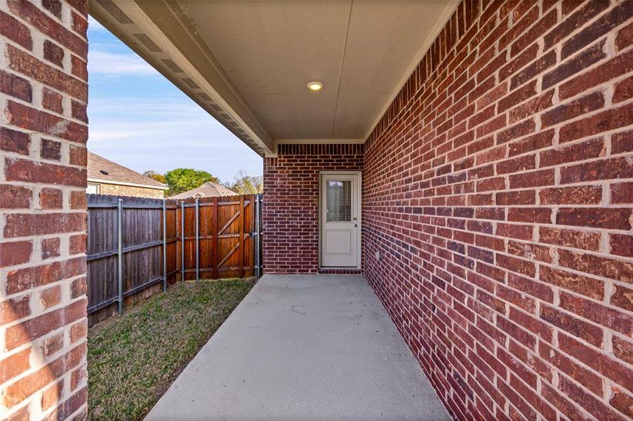 Exterior details and patio area of a home in Azle Grove, Azle (Image 29).