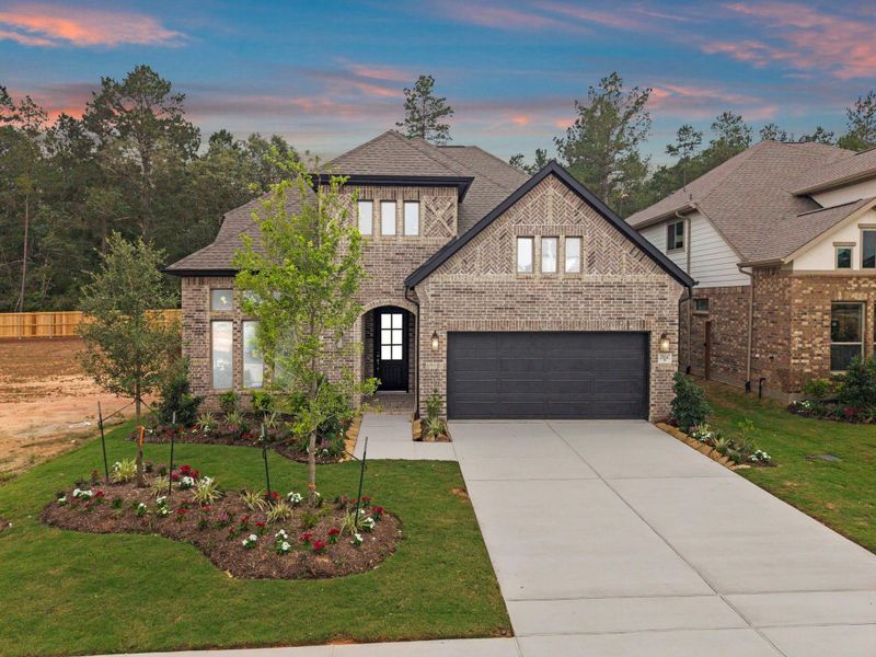 Front exterior of a new home in Wildtree, Magnolia, TX, highlighting curb appeal (Image 20).