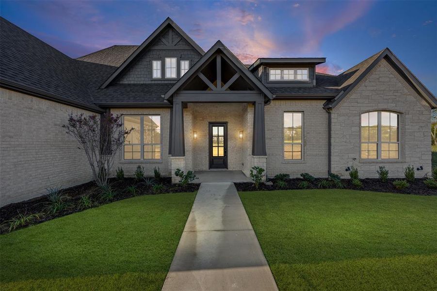 Front exterior of a new home in Waterfall Ranch - 1 Acre Lots, Waxahachie, TX, highlighting curb appeal (Image 2). Front exterior of a new home in Waterfall Ranch - 1 Acre Lots, Waxahachie, TX, highlighting curb appeal (Image 2).