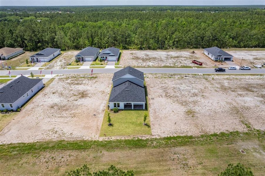 Front exterior of a new home in Gray Hawk at Hole Two, Daytona Beach, FL, highlighting curb appeal (Image 33). Front exterior of a new home in Gray Hawk at Hole Two, Daytona Beach, FL, highlighting curb appeal (Image 33).
