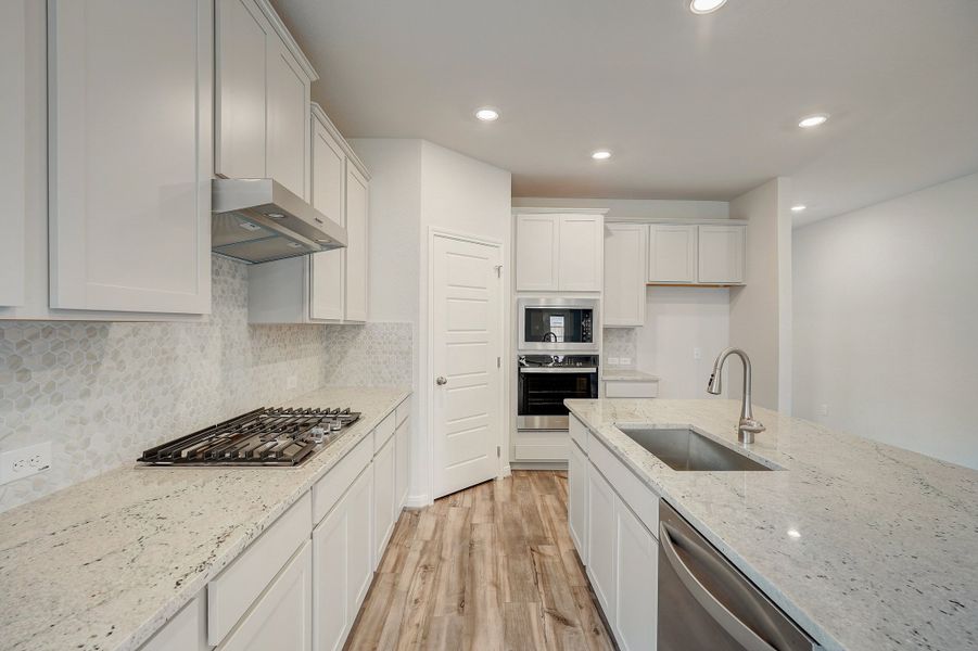 Kitchen in the Pearl floorplan at a Meritage Homes community.