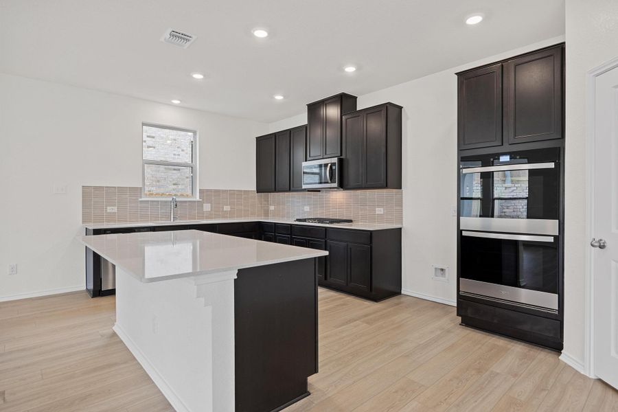 Furnished interior view inside a new home in Salerno - Classic Collection, Round Rock (Image 11). Furnished interior view inside a new home in Salerno - Classic Collection, Round Rock (Image 11).