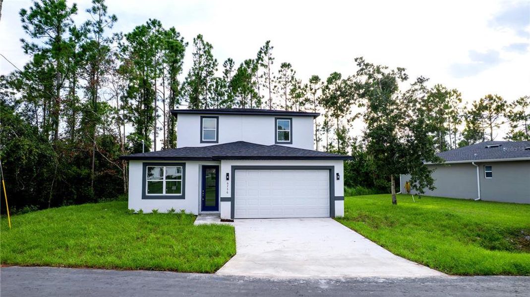 Front exterior of a new home in , St. Cloud, FL, highlighting curb appeal (Image 2). Front exterior of a new home in , St. Cloud, FL, highlighting curb appeal (Image 2).