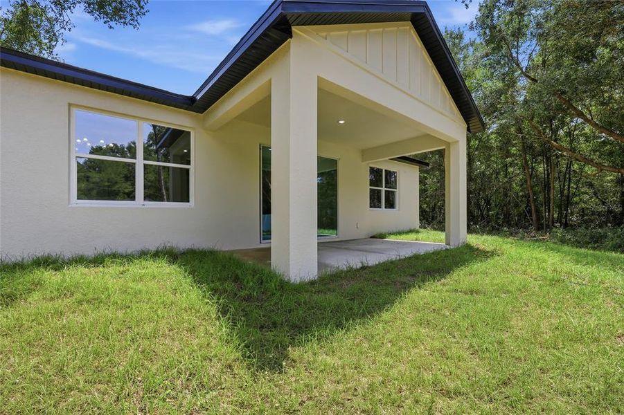 Exterior details and patio area of a home in , Summerfield (Image 17).