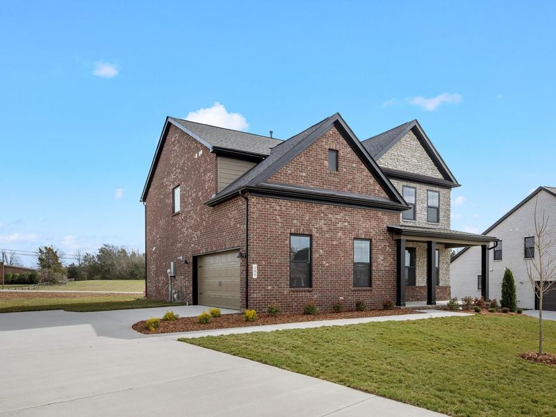 Front exterior of a new home in Benders Cove, Mount Juliet, TN, highlighting curb appeal (Image 25).