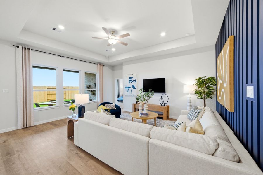 A living room with a large window. A living room with a large window.