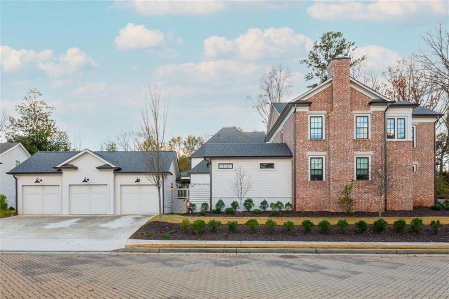 Front exterior of a new home in Barrington Place, Roswell, GA, highlighting curb appeal (Image 27). Front exterior of a new home in Barrington Place, Roswell, GA, highlighting curb appeal (Image 27).