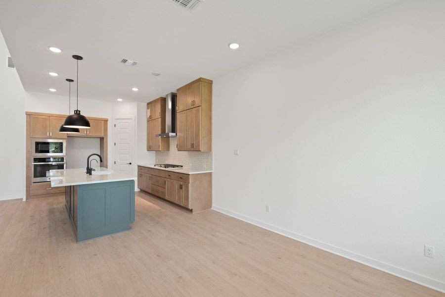Furnished interior view inside a new home in Wolf Ranch, Georgetown (Image 15).