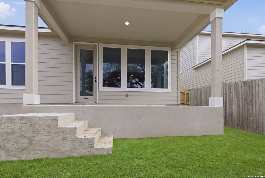 Exterior details and patio area of a home in The Meadows at Hunters Ranch, San Antonio (Image 3).