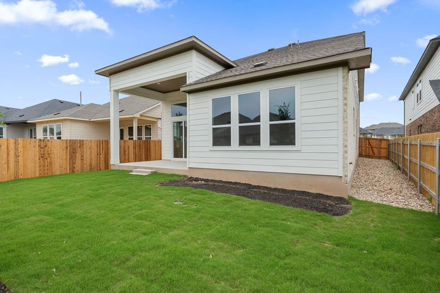 Exterior details and patio area of a home in Heritage, Dripping Springs (Image 27).