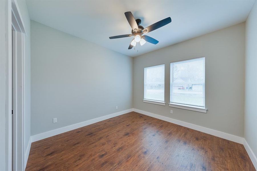 Throughout the home, ceiling fans provide added comfort and a cool breeze, enhancing the living spaces.