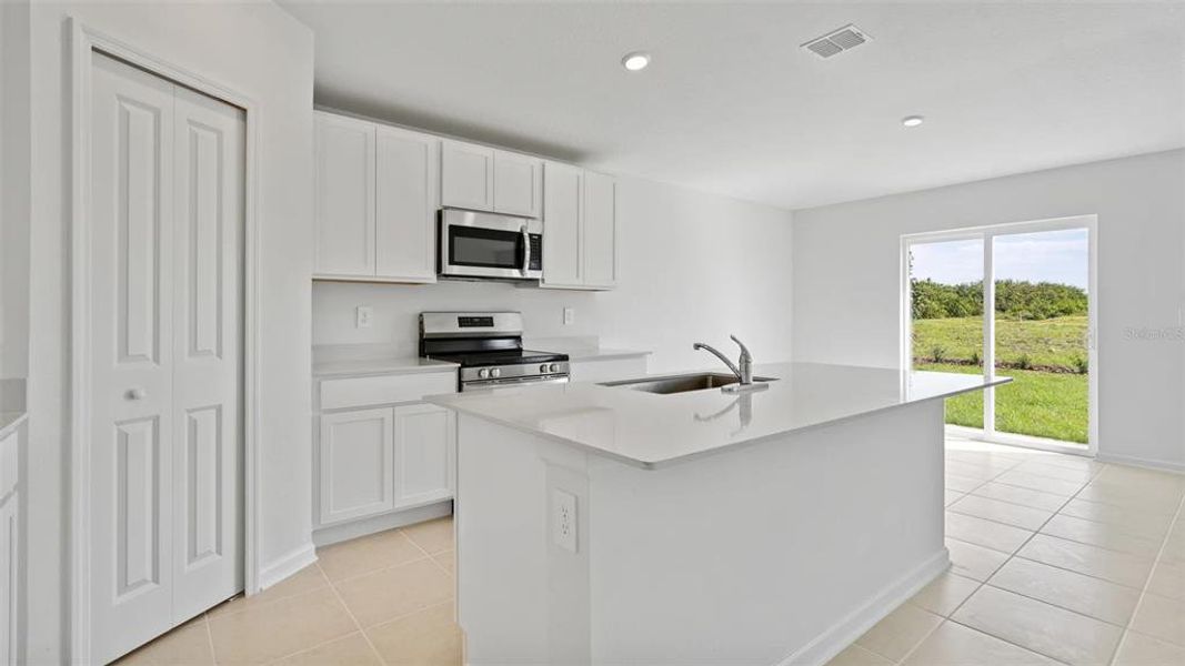 Furnished interior view inside a new home in Peace Creek Reserve: Manor Key Collection, Winter Haven (Image 5).