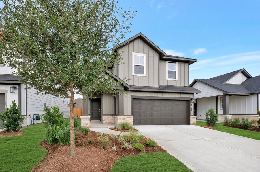Front exterior of a new home in Mason Woods, Cypress, TX, highlighting curb appeal (Image 19). Front exterior of a new home in Mason Woods, Cypress, TX, highlighting curb appeal (Image 19).